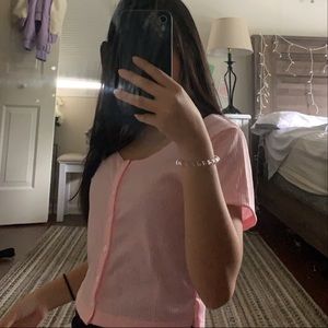 Pink button up top